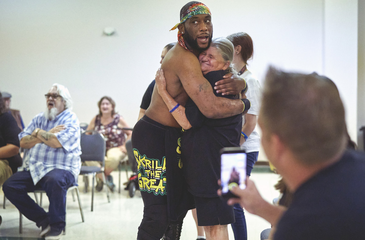 Skrilla the Great embraces a fan.